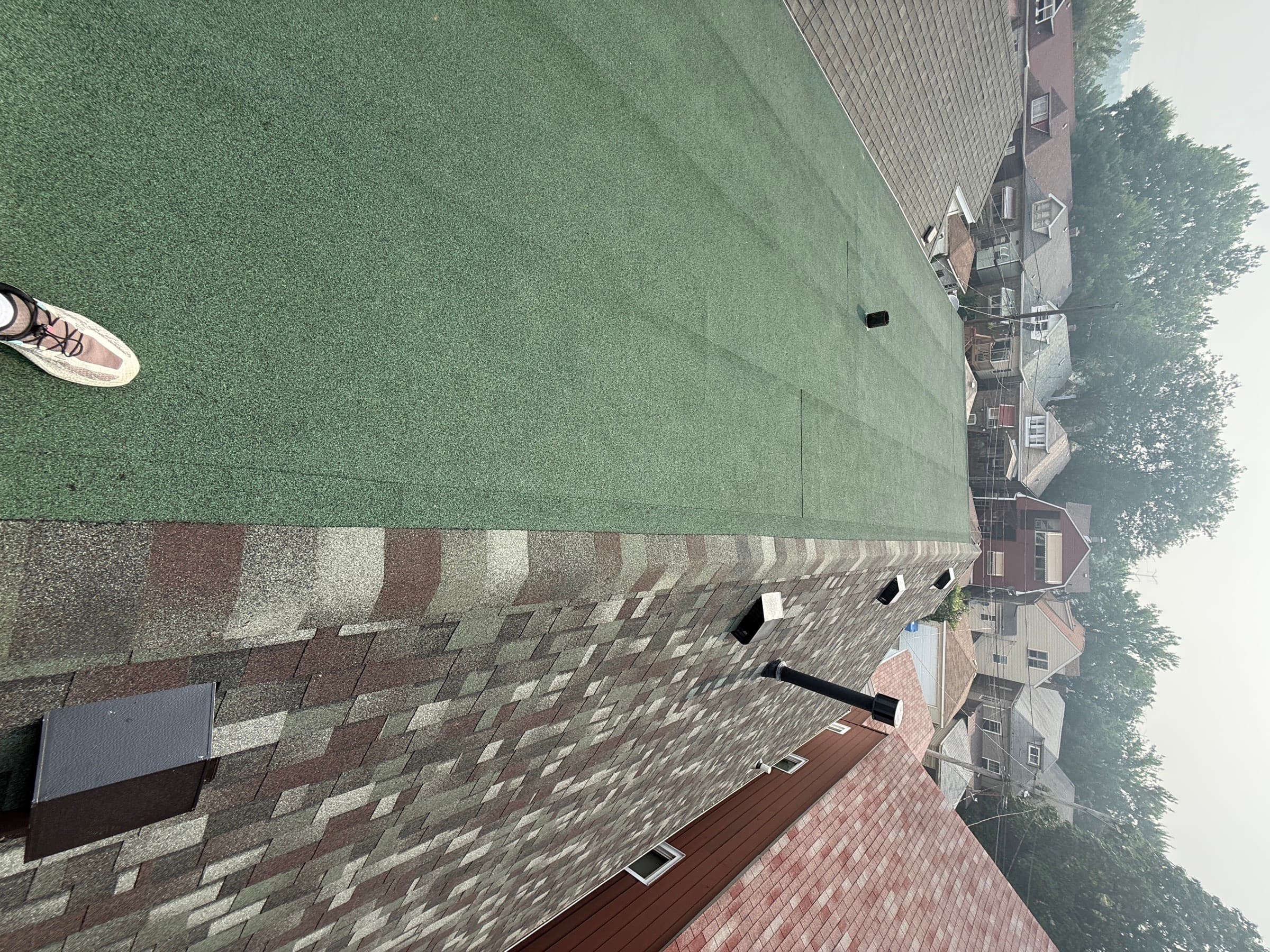 On-roof view of an Ace re-roof, every section documented